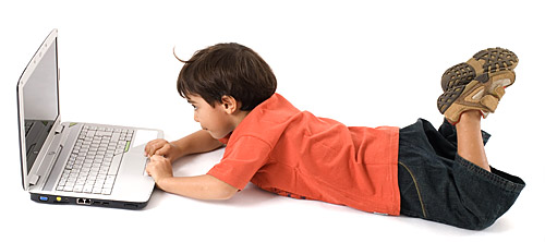 Boy using a laptop.